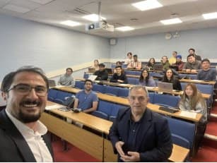 Coskun Tarkocin with students in a lecture theatre at King's Business School
